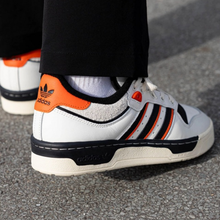 Load image into Gallery viewer, adidas - Rivalry 86 Low - Cloud White/Black/Orange - Unisex [IE7140]